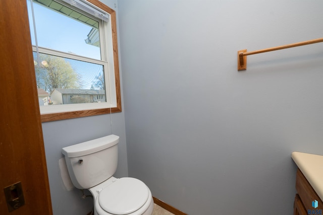 bathroom with toilet and vanity