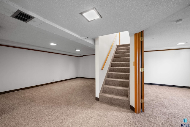 stairway featuring recessed lighting, visible vents, baseboards, and carpet floors