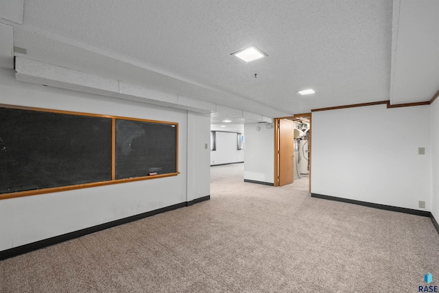 finished below grade area with baseboards, carpet flooring, and a textured ceiling