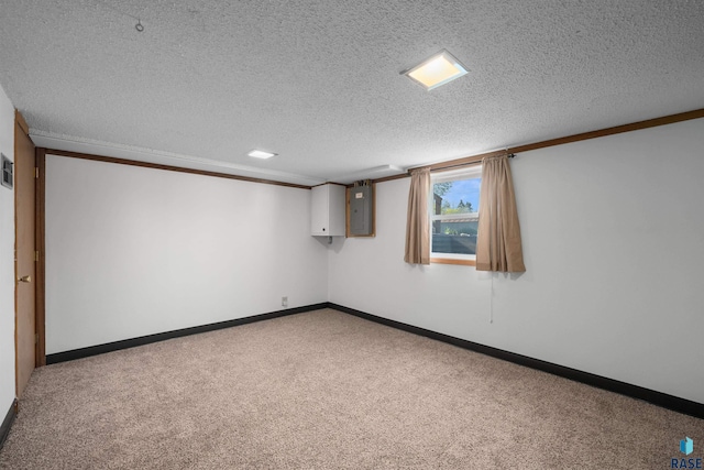 spare room featuring a textured ceiling, baseboards, carpet, and electric panel