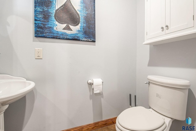 bathroom featuring toilet