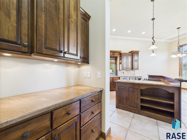 6204 S Doral Trl, Sioux Falls, SD 57108 - kitchen with open shelves, light tile patterned floors, tasteful backsplash, crown molding, and decorative light fixtures