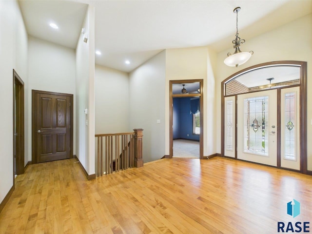 6204 S Doral Trl, Sioux Falls, SD 57108 - entryway with light wood-style floors, baseboards, a high ceiling, and recessed lighting