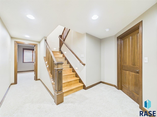 6204 S Doral Trl, Sioux Falls, SD 57108 - stairs featuring carpet floors, baseboards, and recessed lighting
