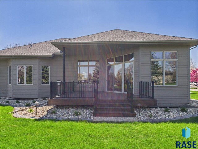 6204 S Doral Trl, Sioux Falls, SD 57108 - back of property featuring a porch, a lawn, and roof with shingles