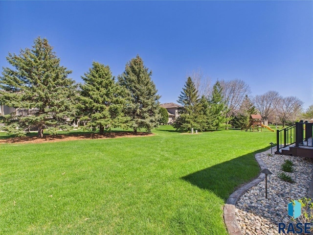 6204 S Doral Trl, Sioux Falls, SD 57108 - view of grassy yard with a playground