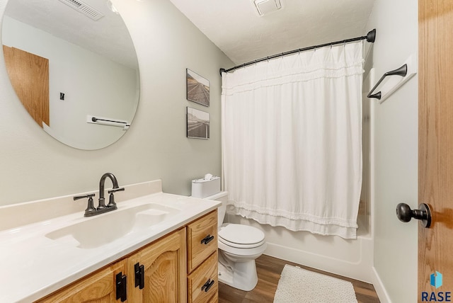 full bathroom with toilet, visible vents, shower / bath combination with curtain, vanity, and wood finished floors