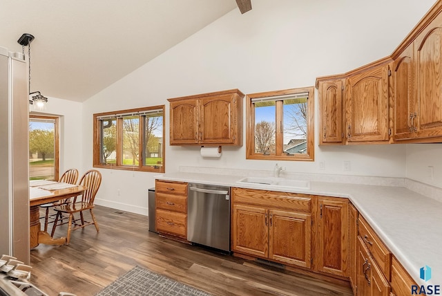 kitchen with dishwasher, dark wood-style flooring, brown cabinets, and a sink