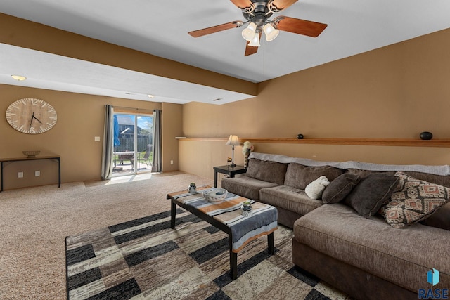 carpeted living room with a ceiling fan