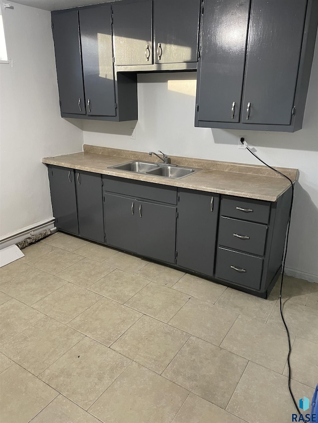 207 W 14th St, Sioux Falls, SD 57104 - kitchen with a sink, light tile patterned flooring, gray cabinetry, and light countertops