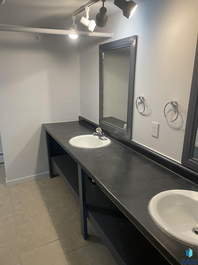 207 W 14th St, Sioux Falls, SD 57104 - bathroom with tile patterned floors, double vanity, and a sink