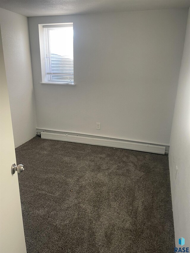 207 W 14th St, Sioux Falls, SD 57104 - carpeted spare room featuring a baseboard radiator