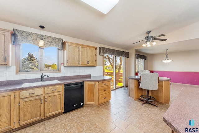 kitchen with decorative light fixtures, dishwasher, ceiling fan, a sink, and backsplash