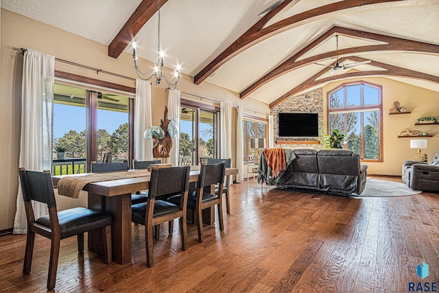 6601 Lenola Hts, Wentworth, SD 57075 - dining space featuring baseboards, ceiling fan with notable chandelier, high vaulted ceiling, hardwood / wood-style flooring, and beamed ceiling