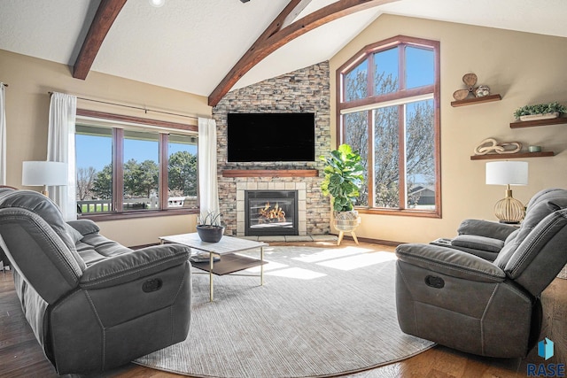 6601 Lenola Hts, Wentworth, SD 57075 - living area with baseboards, lofted ceiling with beams, a fireplace, and wood finished floors