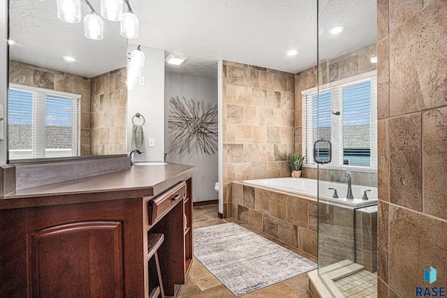 6601 Lenola Hts, Wentworth, SD 57075 - bathroom with a sink, tile walls, a shower, a textured ceiling, and a bath