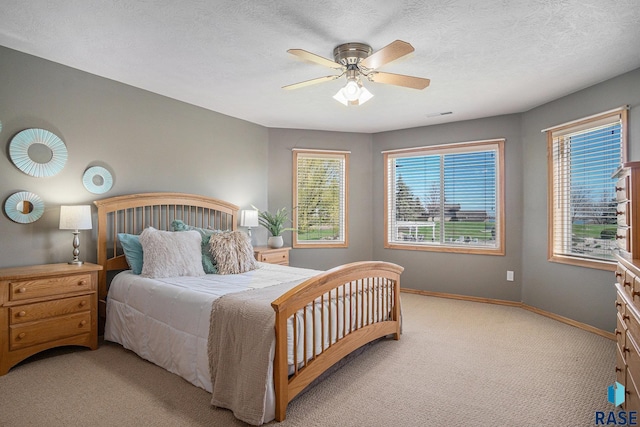 6601 Lenola Hts, Wentworth, SD 57075 - carpeted bedroom featuring visible vents, baseboards, and ceiling fan