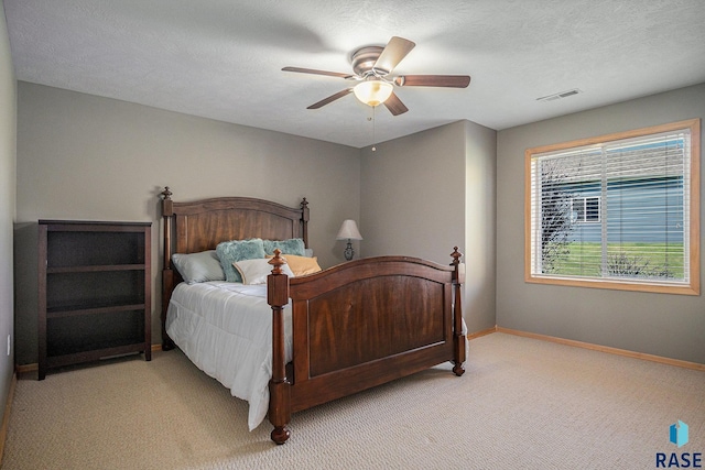 6601 Lenola Hts, Wentworth, SD 57075 - bedroom with baseboards, a ceiling fan, visible vents, and light colored carpet