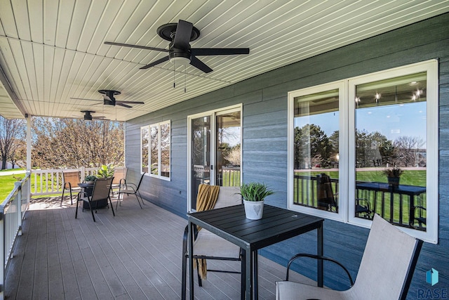 6601 Lenola Hts, Wentworth, SD 57075 - deck with outdoor dining space and ceiling fan