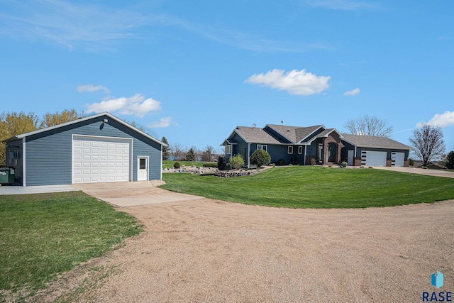6601 Lenola Hts, Wentworth, SD 57075 - single story home featuring a front lawn, concrete driveway, an outbuilding, and a garage