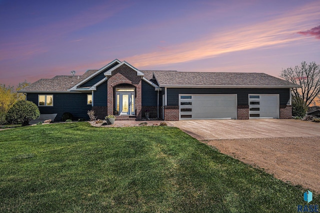 6601 Lenola Hts, Wentworth, SD 57075 - ranch-style house featuring concrete driveway, a yard, brick siding, and a garage