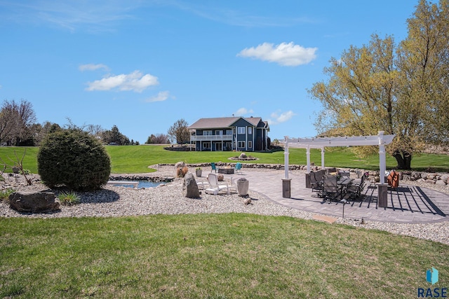 6601 Lenola Hts, Wentworth, SD 57075 - view of community featuring a patio, a pergola, and a lawn