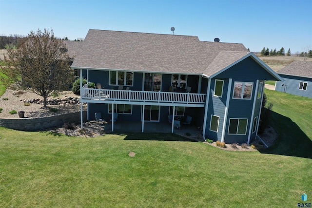 6601 Lenola Hts, Wentworth, SD 57075 - back of house featuring a yard, roof with shingles, and a deck