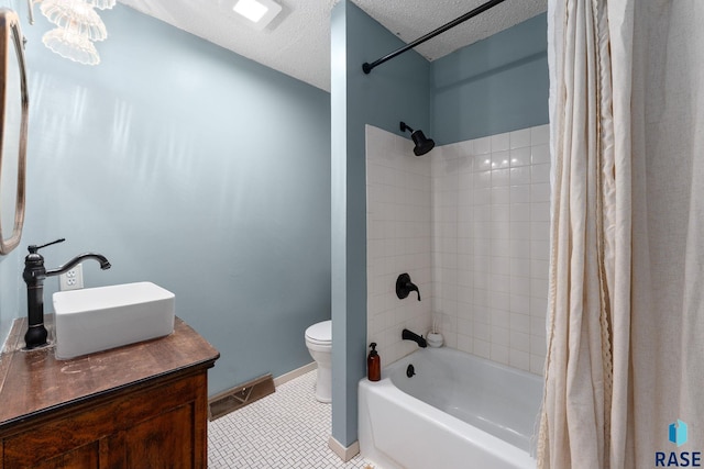 20395 Northgrove Loop, Brookings, SD 57006 - bathroom with toilet, vanity, a textured ceiling, tile patterned floors, and shower / tub combo