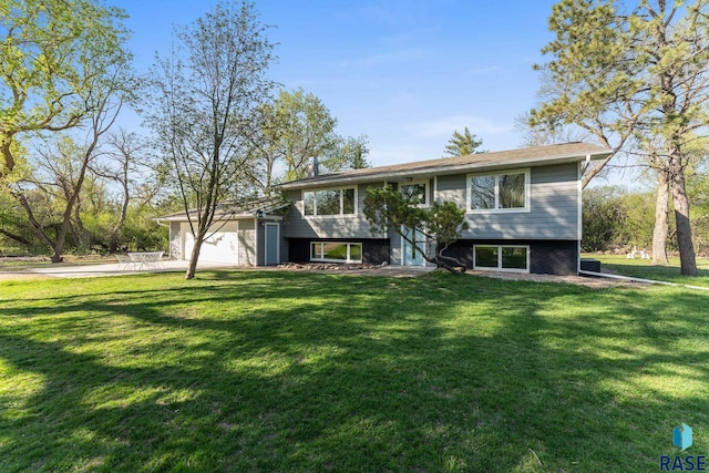 20395 Northgrove Loop, Brookings, SD 57006 - raised ranch featuring concrete driveway, a front lawn, and an attached garage