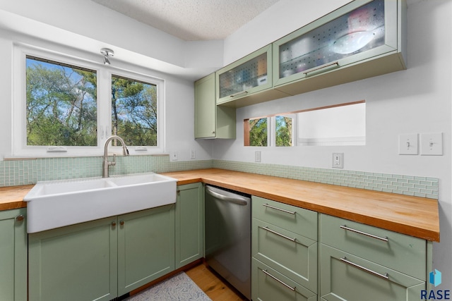 20395 Northgrove Loop, Brookings, SD 57006 - kitchen featuring dishwasher, green cabinetry, wooden counters, and a sink