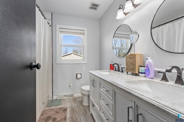 1120 Blaine St, Larchwood, IA 51241 - full bathroom featuring a sink, plenty of natural light, and visible vents