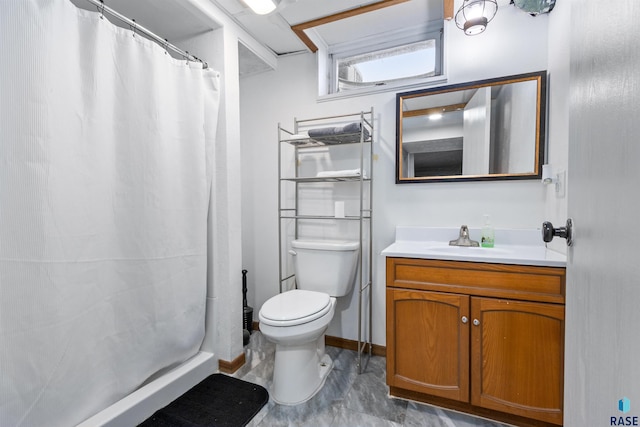 1120 Blaine St, Larchwood, IA 51241 - full bathroom featuring toilet, baseboards, vanity, and a shower with shower curtain