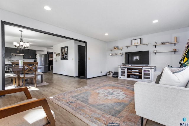 1120 Blaine St, Larchwood, IA 51241 - living room with baseboards, an inviting chandelier, recessed lighting, and wood finished floors