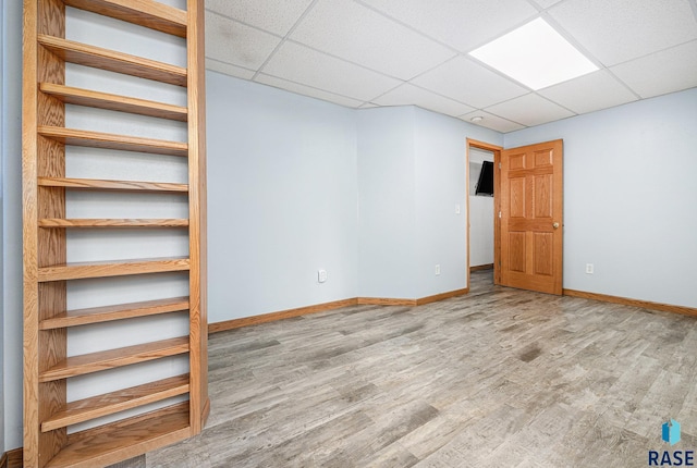 46788 278th St, Lennox, SD 57039 - interior space with wood finished floors, baseboards, and a drop ceiling