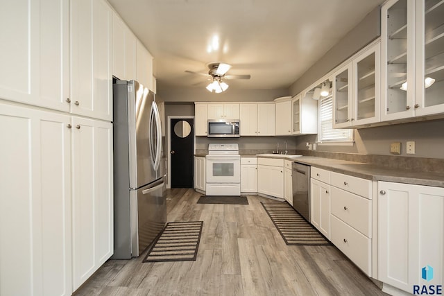 420 S Mary Ave, Tea, SD 57064 - kitchen with stainless steel appliances, ceiling fan, light wood finished floors, and white cabinets