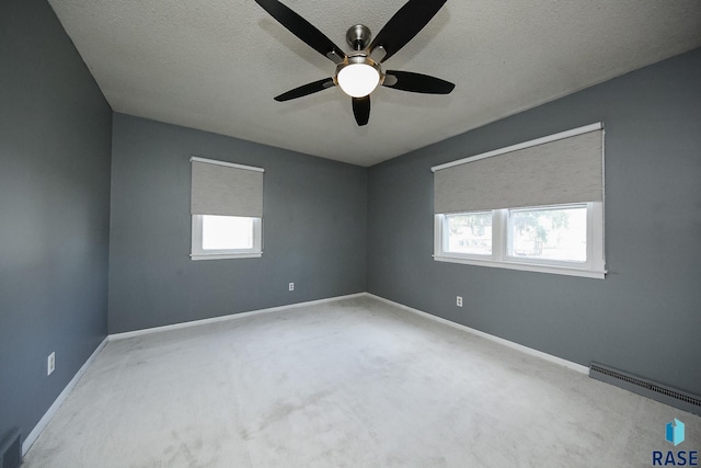420 S Mary Ave, Tea, SD 57064 - unfurnished room with ceiling fan, a textured ceiling, baseboards, and carpet floors