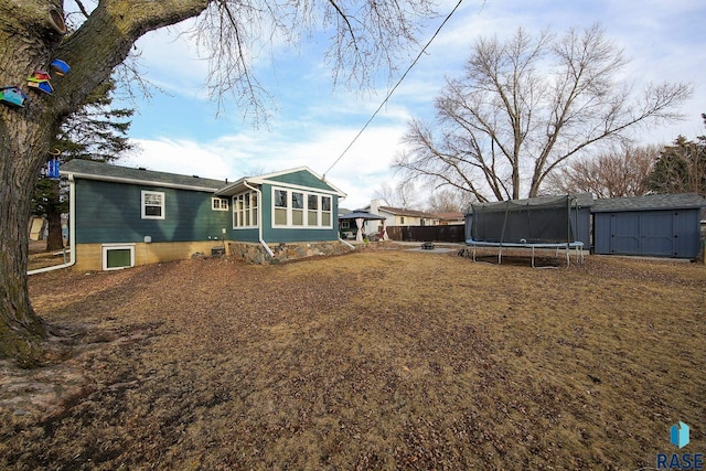 420 S Mary Ave, Tea, SD 57064 - rear view of property featuring a trampoline, a storage unit, an outdoor structure, and a gazebo