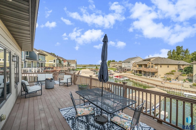 6014 Marrs Beach Ln, Madison, SD 57042 - wooden deck with a residential view and outdoor dining area