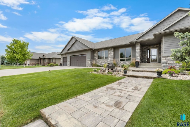 2708 W Bitterroot St, Sioux Falls, SD 57108 - view of front of property featuring a garage, stone siding, a front lawn, and concrete driveway
