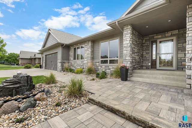 2708 W Bitterroot St, Sioux Falls, SD 57108 - view of side of property with stone siding, driveway, and a garage