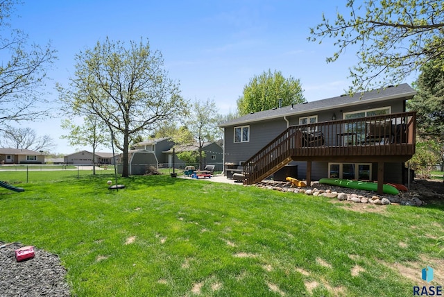 back of property with a wooden deck, stairs, and a patio area