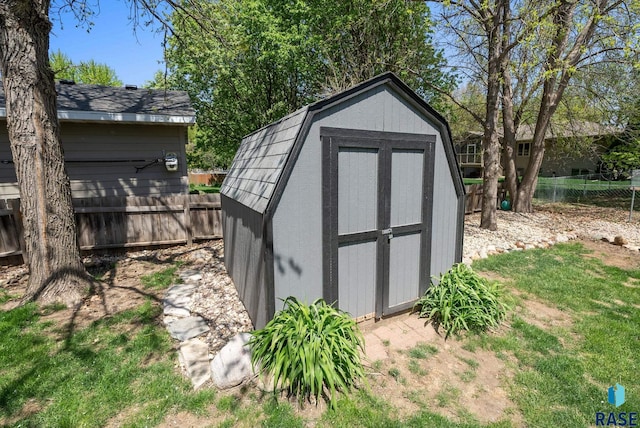 view of shed with fence
