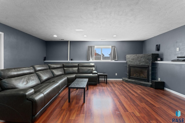 925 E Steep St, Tea, SD 57064 - living area with wood finished floors, a textured ceiling, a fireplace, recessed lighting, and baseboards