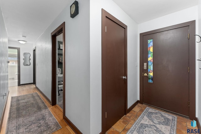 entrance foyer featuring baseboards