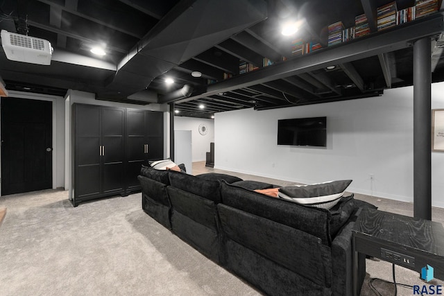 cinema featuring light carpet and baseboards