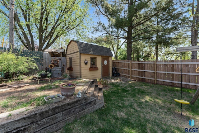 view of yard with a shed and an outbuilding