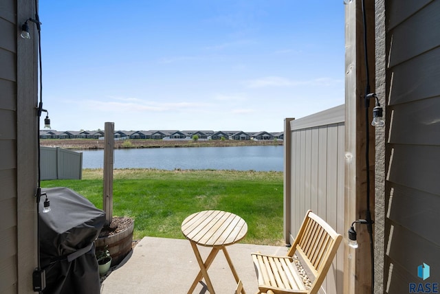 5520 S Seville Pl, Sioux Falls, SD 57108 - view of patio / terrace with a water view, a residential view, and a grill