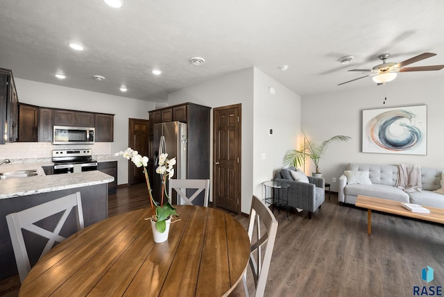 5520 S Seville Pl, Sioux Falls, SD 57108 - dining space with a ceiling fan, dark wood-style flooring, recessed lighting, and baseboards