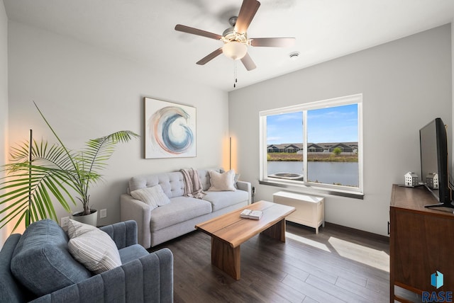 5520 S Seville Pl, Sioux Falls, SD 57108 - living room with dark wood-type flooring, a ceiling fan, and baseboards