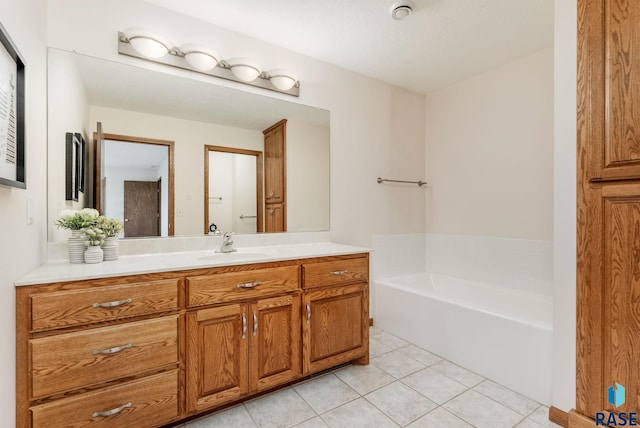 110 W Apple St, Tea, SD 57064 - full bathroom with tile patterned floors, a garden tub, and vanity